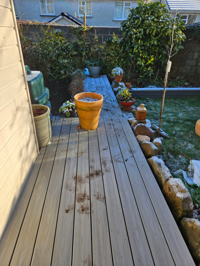 Wooden Deck in A Garden with Various Potted Plants — Alpha and Omega Refurbishment in Tuam, Galway