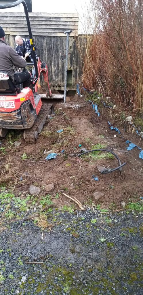 A Mini-Excavator, Clearing a Muddy Garden Area — Alpha and Omega Refurbishment in Tuam, Galway