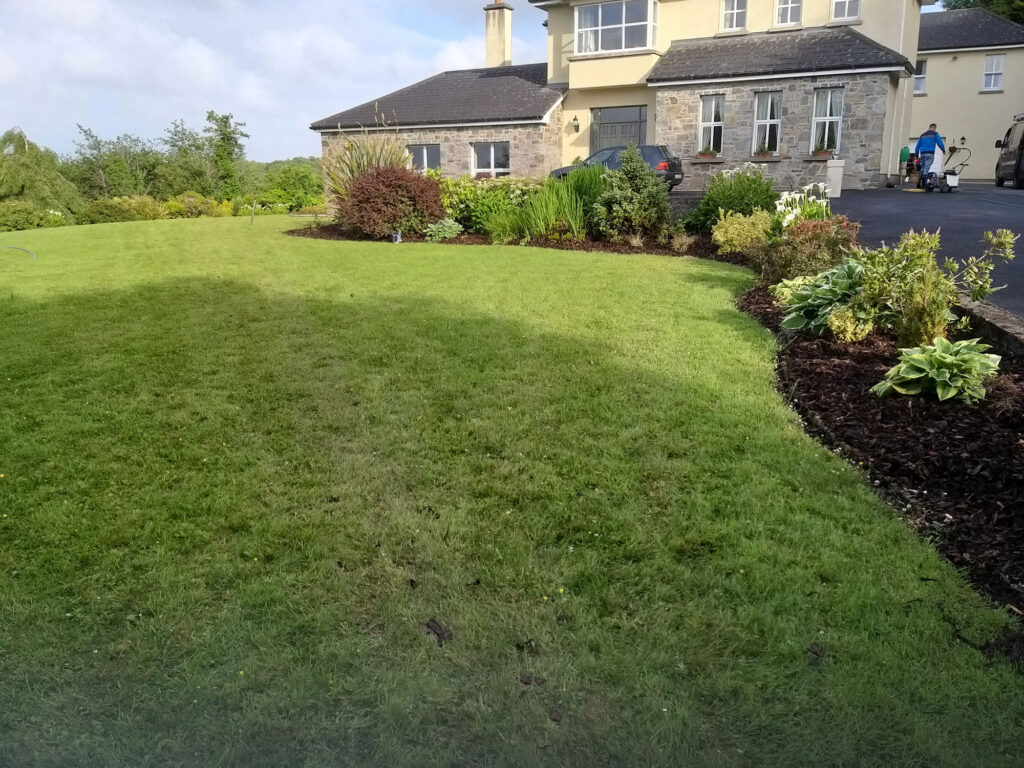 Wide View of a Lawn Next to a Beautiful Home — Alpha and Omega Refurbishment in Tuam, Galway