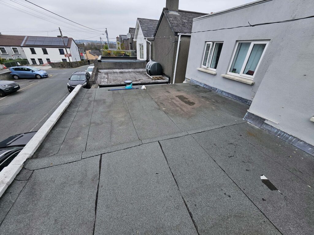 Flat Roof Sealant Application in Progress — Alpha and Omega Refurbishment in Tuam, Galway